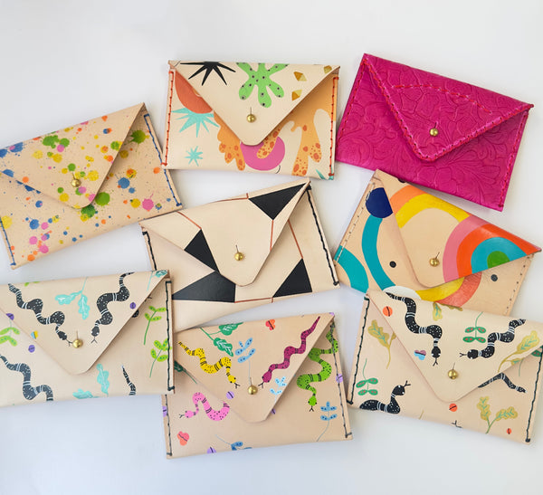 hand-painted and hand-stitched leather wallets.